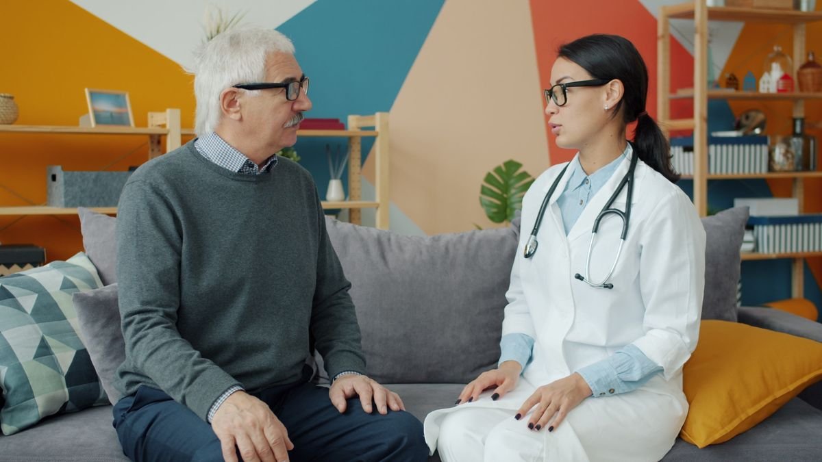 Senior man consulting with a doctor in a modern medical office