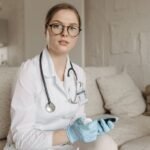 Doctor assessing blood sugar control with a glucometer during a consultation