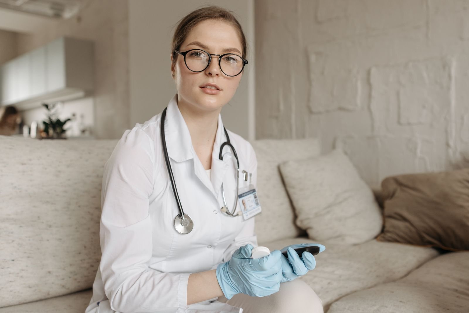 Doctor assessing blood sugar control with a glucometer during a consultation