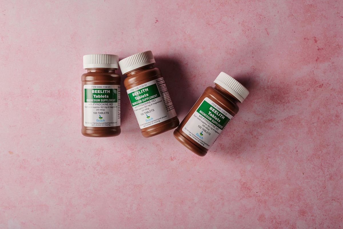 Bottles of magnesium supplement tablets used for sleep support