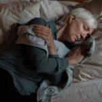 Senior woman sleeping peacefully in bed at night