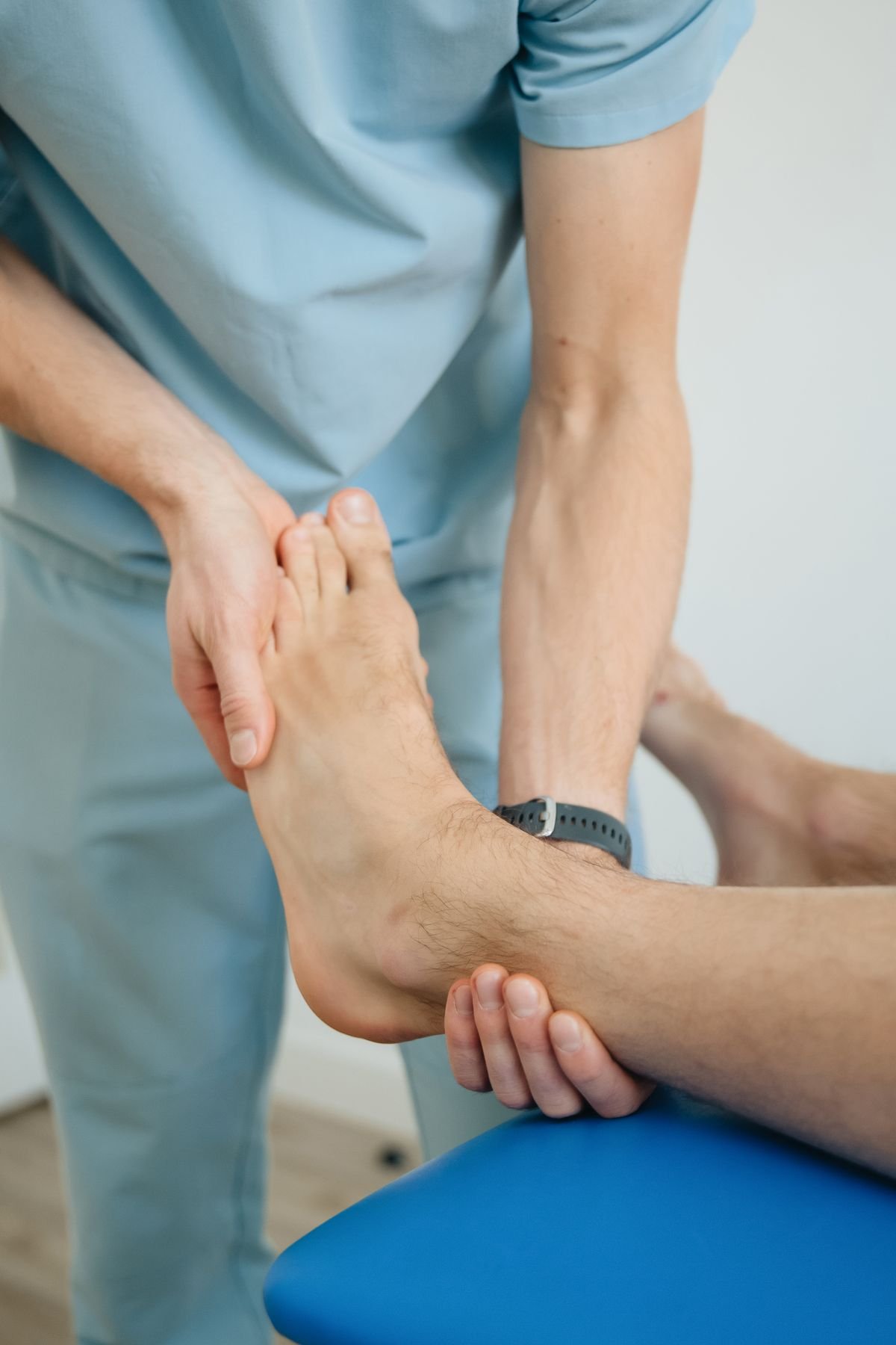 Physiotherapist performing foot therapy for a patient with nerve-related foot symptoms
