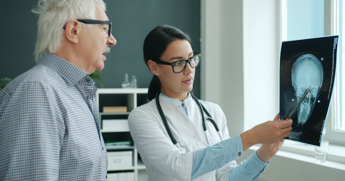 Doctor explaining test results to a senior patient during a medical office visit