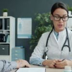 Senior man discussing his blood test results with his doctor in a medical office