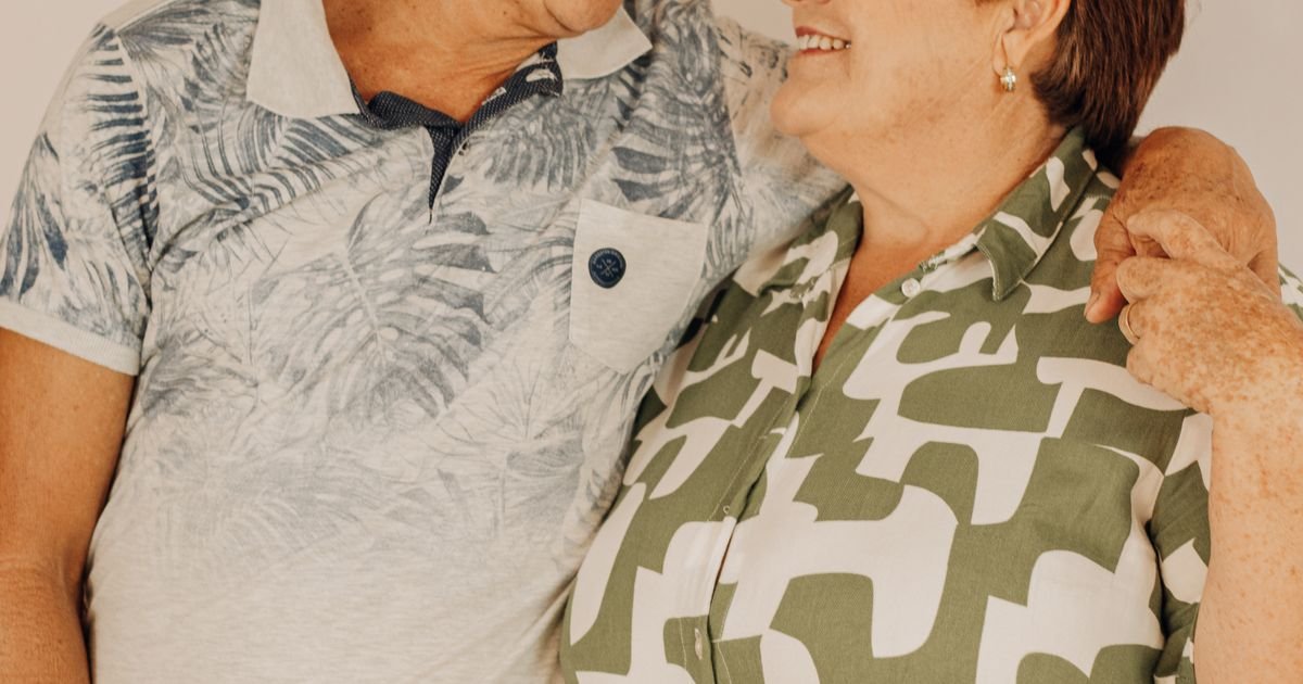 Older couple smiling warmly at each other