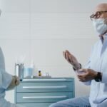 Senior man discussing health concerns with a medical professional in a clinic
